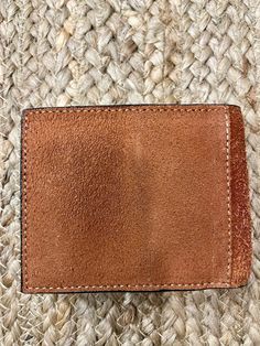 hand tooled, top grain leather, heavy duty stitching, multiple credit card slots. Leather Rectangular Card Holder For Everyday Carry, Rectangular Leather Trifold Wallet For Everyday Use, Rectangular Leather Patch Wallet For Everyday Use, Rectangular Wallets With Leather Patch For Everyday Use, Leather Trifold Wallet With Card Slots For Everyday, Distressed Brown Bifold Wallet For Everyday Use, Rectangular Wallets With Leather Lining For Everyday Carry, Brown Bifold Wallet With Leather Patch, Leather Trifold Card Holder With Leather Lining