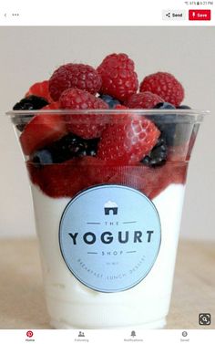 yogurt with berries, raspberries and blueberries in a plastic cup