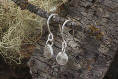 Silver pebble earrings are made of sold reclaimed fine silver with concentric circles carved in the surface. New Sterling ear wires. Arrive in a gift box. My Process: The gems in this collection are either hand picked cut and polished in our studio or fair mined at small, artisan mines in the US giving a transparent path from the mine to the bench. We start with reclaimed & recycled gold - with metal suppliers that third party certification. Concentric Circles, Recycled Gold, Hand Picked, Fine Silver, Ear Wires, Circles, Gift Box, Gems, Carving