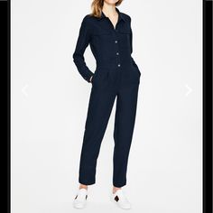 Nwt. Boden Zada Navy Jumpsuit. Easy To Dress Up With Heels Or Down With Sneakers. Lightweight Crepe Fabric Is Satin-Backed For A Silky Feel. Fitted Through Hip With A Straight Leg. Ankle Length. Button-Down Front, Zipper At Waist. Front Slap Pockets And Side Pockets! 6: Total Length 56”, Inseam 27”, Armpit To Armpit 19”, Waist Laying Flat 15.25 Navy Jumpsuits And Rompers With Pockets, Casual Fitted Pantsuit With Pockets, Casual Navy Jumpsuits And Rompers For Workwear, Elegant Cotton Jumpsuit For Work, Relaxed Fit Jumpsuits And Rompers For Work, Elegant Relaxed Fit Jumpsuit For Work, Chic Navy Jumpsuit For Work, Blue Overall Jumpsuit For Work, Blue Denim Jumpsuit For Work