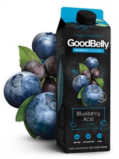 a carton of good belly blueberry acai juice next to some blueberries