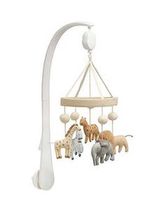 a baby crib mobile with animals hanging from it's sides and a light fixture in the background