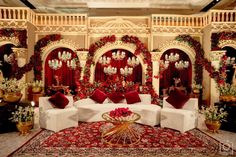 a living room decorated in red and white