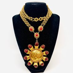 Wow Amazing Vintage Signed Bill Smith  RICHELIEU Medallion Carnelian Glass Necklace. Antiqued gold plated metal in a spiked medallion design with carnelian glass elements and accented with rhinestones and on double strand etched rolo link chains with carnelian glass stations. I cannot overstate how gorgeous this is or how bold. Signed on reverse. In excellent vintage condition with age appropriate wear. Pendant measures 4 3/8 inches long by 3 inches wide. The stations in the chains measure 3/4 i Luxury Gold Carnelian Jewelry, Vintage Designer Jewelry, Medallion Design, Vintage Designer, Glass Necklace, Designer Jewelry, Vintage Signs, Antique Gold, Vintage Designs