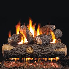 a fire is burning in the fireplace with logs and flames on it's sides