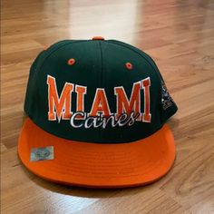 Miami Canes Adjustable Flat Brim Hat Nwot. No Flaws, Stains Or Rips. Smoke Free/Pet Free Home Orange Casual Baseball Cap For Sports Events, Casual Orange Baseball Cap For Sports Events, Casual Orange Sports Hat, Orange Snapback Hats For Sports Events, Casual Orange Snapback Hat With Flat Brim, Casual Orange Hat For Sports Events, Flat Brim Hat, Mens Green, Brim Hat