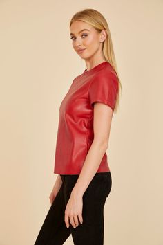 Get back to basics⁠—but with a stylish edge⁠—with our Faux Leather Shirt. This classic wardrobe staple gets a touch of urban flair with its sleek, faux leather material. Designed for casual comfort, this leather t-shirt boasts a relaxed fit and a zipper closure at the back for hassle-free dressing. You can’t go wrong with a white or black leather shirt if you want a piece that works well with most of your wardrobe, but if you want to branch out, our Faux Leather Shirt also comes in Red, Army, an Faux Leather Shirt, Leather T Shirt, Suede Outfit, Blouse Tank Top, Classic Wardrobe Staples, Maxi Dress Cocktail, Classic Wardrobe, Leather Shirt, Back To Basics