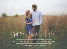 the save the date photo card is shown in front of tall grass