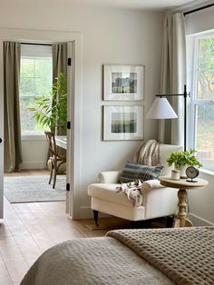 a living room filled with furniture next to a window