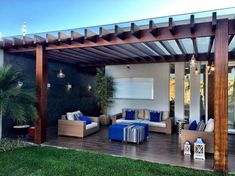 an outdoor living area with blue and white furniture