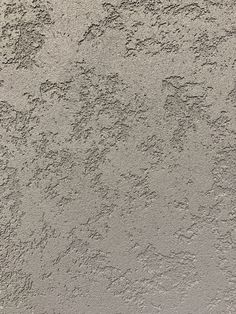 the texture of concrete is white and gray