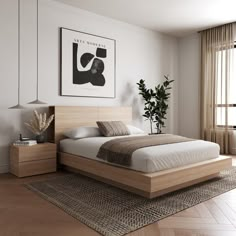 a bedroom with white walls and wooden floors