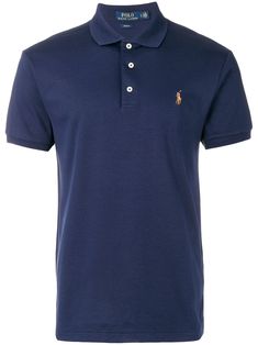 Every season, Polo Ralph Lauren helps to redefine contemporary men's style. Crafted from pure, naturally breathable cotton, this sport-inspired shirt is an essential item for any modern man's wardrobe. With Polo Ralph Lauren's contemporary slim fit and a straight hem with side slits, this blue polo shirt features a ribbed polo collar, a front button placket, short sleeves and a signature embroidered multicoloured pony at the left chest. Ralph Lauren Store, Logo Azul, Blue Polo Shirt, Blue Polo Shirts, Ralph Lauren Outfits, Blue Polo, Cotton Polo Shirt, Men's Wardrobe, Cotton Polo