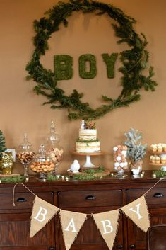 a baby shower is displayed on a dresser