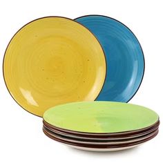 four different colored plates stacked on top of each other