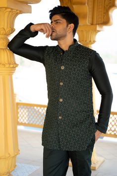 Emerald green handwork bundi with detailed cutdana and French knot embroidery. Paired with a monotone kurta and pant.
Components: 3
Pattern: Embroidered
Type Of Work: French Knot,Cutdana
Neckline: Band
Sleeve Type: Full
Fabric: Suiting,Chanderi silk
Color: Green
Other Details: 
Front buttons
Hand work
Occasion: Wedding - Aza Fashions Green Outerwear With Zari Work For Festivals, Fitted Green Bandhgala With Resham Embroidery, Fitted Green Outerwear With Resham Embroidery, Festive Green Outerwear With Zari Work, Festive Designer Green Outerwear, Green Zari Work Outerwear For Eid, Unstitched Green Traditional Bandhgala, Eid Designer Wear Nehru Jacket In Green, Fitted Green Bandhgala With Dabka Detail