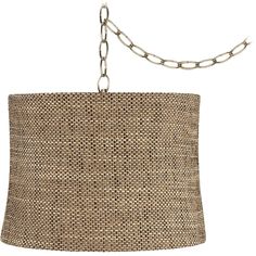 a lamp shade hanging from a chain