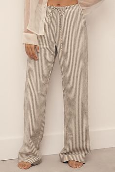 Linen, cotton Pull-on styling Dry clean USA | Linen Striped Drawstring Pants by DONNI. in White, Women's, Size: Small, Cotton/Linen at Anthropologie Chic Striped Linen Bottoms, Linen Pants Striped, Casual Pinstripe Linen Bottoms, Striped Cotton Lounge Bottoms, Striped Linen Beach Pants, Thailand Outfit, Comfortable Pajamas, Drawstring Pants, Sleepwear Women