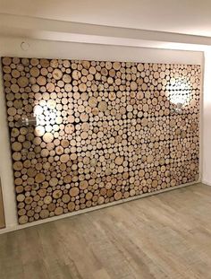 a room with wood logs on the wall