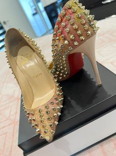 Designer Studded Party Heels, Designer Party Heels With Studs, Luxury Studded Party Heels, Luxury Studded Heels For Party, Luxury Formal Heels With Gold Studs, Luxury Gold Studs Heels For Formal Occasions, Luxury Gold Studded Heels For Formal Occasions, Designer Party Heels With Spikes, Designer Spiked Heels For Party