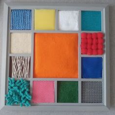 an assortment of different colored materials in a tray