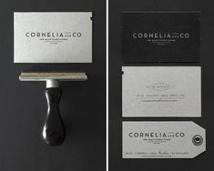 some black and white business cards on top of each other with the name cornella co