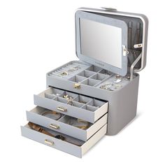 an open jewelry box with five drawers