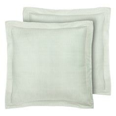 two green striped pillows sitting next to each other