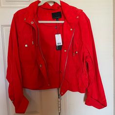 Brand New With Tags Women’s Banana Republic Short Rain Jacket With Hood, Size Xs. Bright Red With A Hint Of Orange, Zips And Buttons Up, Hood Has A Drawstring And Waist Has A Cinch Cord. Two Chest Pockets. Original Price $130 Red Cropped Long Sleeve Casual Jacket, Red Casual Cropped Jacket With Long Sleeves, Red Long Sleeve Cropped Casual Jacket, Red Long Sleeve Cropped Jacket Casual, Red Spring Outerwear With Pockets, Red Hooded Outerwear For Spring, Red Rain Jacket, Black Blazer Style, Linen Blazers Women