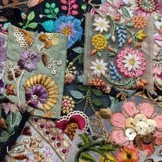 many different types of embroidered fabric with flowers and leaves on the top one is multicolored