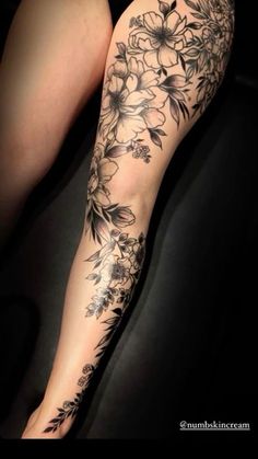 a woman's leg with flowers on it