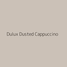 the words dulux dusted cappuccino in black on a gray background