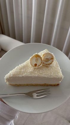 a piece of cake sitting on top of a white plate next to a knife and fork