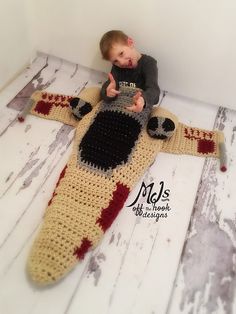 crochet patterns for star wars inspired items including a knitted baby's hat, an infant's yoda costume and a child's head