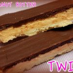 two pieces of peanut butter and chocolate on top of each other with the words twix below it