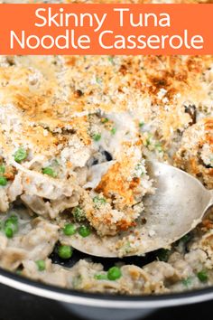 a close up of a casserole in a pan with a spoon and the words skinnyy tuna noodle casserole