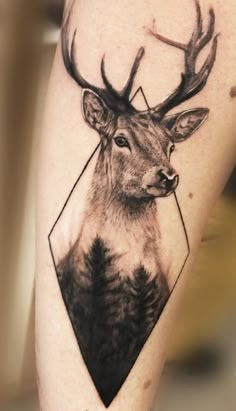 a tattoo with a deer's head on it