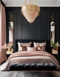 a bedroom with black walls, pink bedding and chandelier hanging from the ceiling