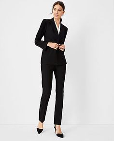 Elevate your wardrobe with the Ann Taylor Petite Fitted Double Breasted Blazer, meticulously designed for a polished and comfortable fit from morning to evening. This blazer is a testament to sophisticated tailoring with its sharp notched lapel, versatile long sleeves that can be styled open or buttoned, and a classic double-breasted front. 

- Size: Petite 00
- Color: Black
- Gender: Female
- Material: Shell - 66% Polyester, 28% Rayon, 6% Spandex; Lining - 100% Polyester
- Fit: Fitted
- Length: Elegant Stretch Blazer For Formal Occasions, Elegant Stretch Blazer For Business Casual, Elegant Stretch Business Blazer, Classic Formal Stretch Outerwear, Classic Stretch Outerwear For Formal Occasions, Elegant Stretch Business Outerwear, Elegant Black Stretch Blazer, Morning Meetings, Ann Taylor Petite