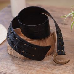 Bright iron accents over elegant black leather make a gorgeous and handy accessory. Designed by Balinese artisan Tomomi, this leather belt features an iron hook buckle for a secure and easy fit, with an adjustable length that will allow you to feel its comfortable and high-quality design. Antique Black Belt Buckles For Festivals, Elegant Black Belt With Brass Buckle, Adjustable Brass Belt Buckle For Everyday Use, Adjustable Brass Buckle Belt For Everyday Use, Adjustable Leather Belts For Everyday, Elegant Adjustable Belts For Festivals, Everyday Leather Adjustable Belt, Elegant Festival Belts, Elegant Adjustable Belt Buckles With Brass Buckle