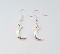 Crescent Moon 3D Earrings A silver coloured crescent moon charm on a silver plated hook. All my earrings are lead and nickel free and are silver plated. Handmade with love and care. Sold in pairs. Colours may vary slightly from photos on your laptop/phone/tablet.  International postage will be sent tracked and/or signed for depending on your location, hence the higher delivery costs. Crescent Silver Earrings As Gift, Nickel-free Silver Moon Earrings, Silver Nickel-free Moon-shaped Earrings, Handmade Silver Half Moon Earrings, Silver Half Moon Earrings For Gift, Silver Moon-shaped Earrings For Gift, Nickel-free Silver Half Moon Earrings, Nickel Free Silver Half Moon Earrings, Silver Pierced Half Moon Earrings