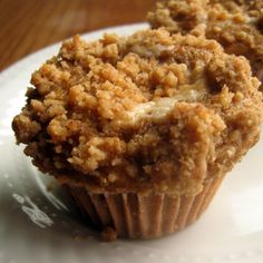 a muffin sitting on top of a white plate