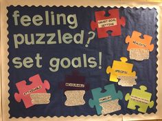 a bulletin board with pieces of puzzle on it that says feeling puzzled, set goals