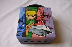 an image of a box with cartoon characters on the front and back sides, sitting on a white sheet