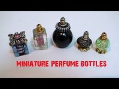 miniature perfume bottles are lined up on a white surface with the words miniature perfume bottles