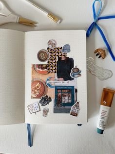 an open notebook with various items on it