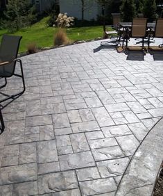 an outdoor patio with chairs and tables