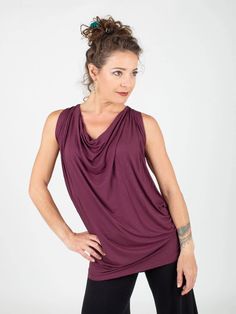 Loose, soft and comfy, our lightweight rayon jersey tunic is fitted at the hips and can be worn as a tunic with leggings, or bunched at the waist with jeans or any skirt or pants. This sophisticated top drapes well on a variety of figures. Classy enough for the office under a jacket or on it's own. [#details] Size Suggestions S/M: 2-6 M/L: 8-12 [/details] [#fabric] Lightweight Rayon Lycra: 90% Rayon (Viscose) / 10% Spandex (Lycra) [/fabric] Versatile Stretch Blouse For Layering, Fitted Rayon Tops For Layering, Casual Stretch Cowl Neck Tops, Stretch Viscose Tops For Layering, Stretch Viscose Tops For Loungewear, Versatile Stretch Rayon Tops, Versatile Viscose Tops For Loungewear, Versatile Viscose Tops For Layering, Stretch Lagenlook Tops For Fall