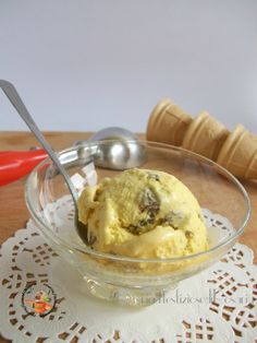 a bowl filled with ice cream on top of a table