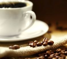 some coffee beans and a banana on a table